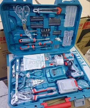 Corded angle grinder and impact drill on a workbench