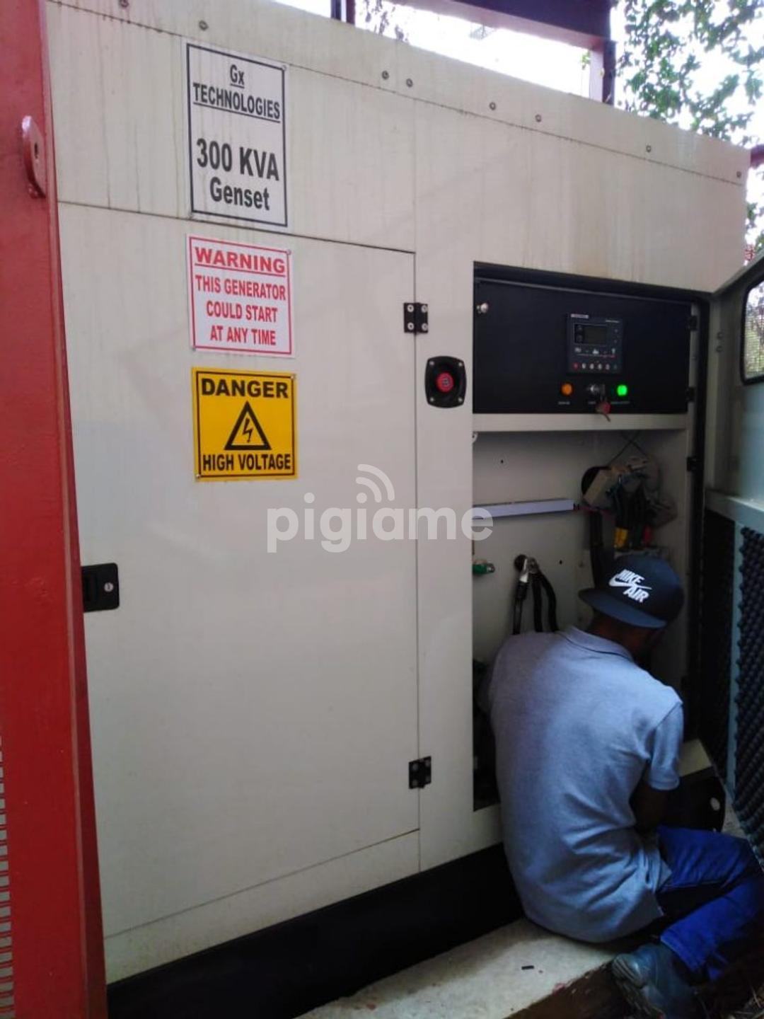 Technician servicing a diesel generator in the workshop