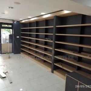 Tool shop interior being fitted with display shelving